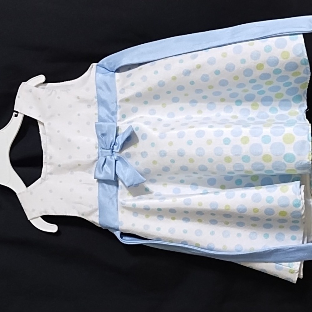 White dressy dress with light blue and green spots. 18 month